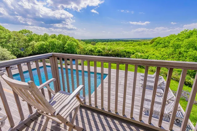 a view of a two chairs in the roof deck