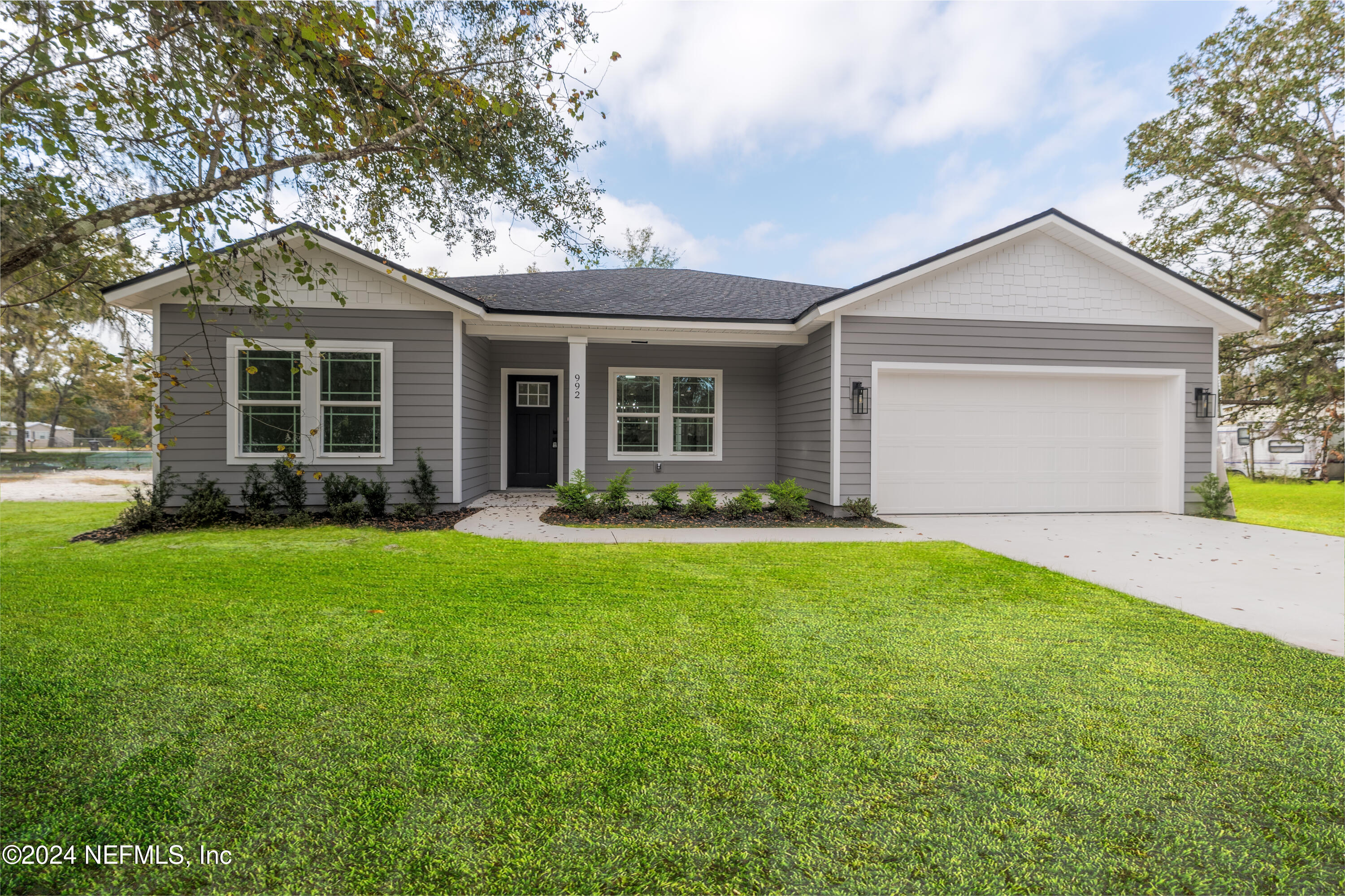 3994 Pinto Road Middleburg, FL 32068 - Photo 1 of 1 a front view of house with yard and green space