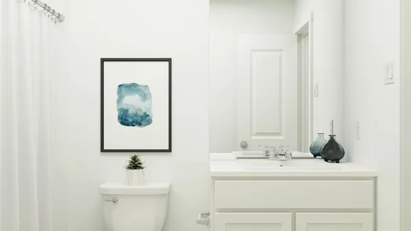 a bedroom with a bed and a night stand