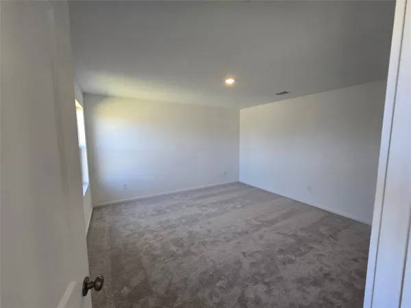 a bathroom with a shower and toilet