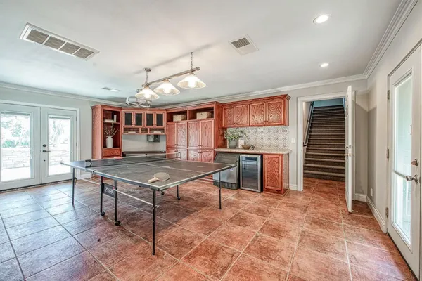 a open kitchen with stainless steel appliances granite countertop a stove refrigerator and cabinets