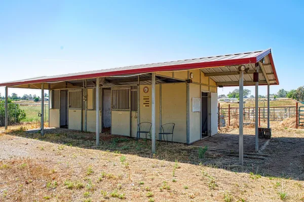 a view of a house with wooden walls