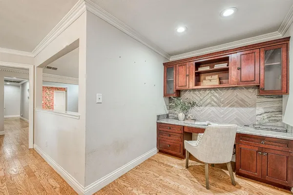 a room with furniture and wooden floor