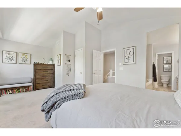 a bedroom with a bed and a lamp