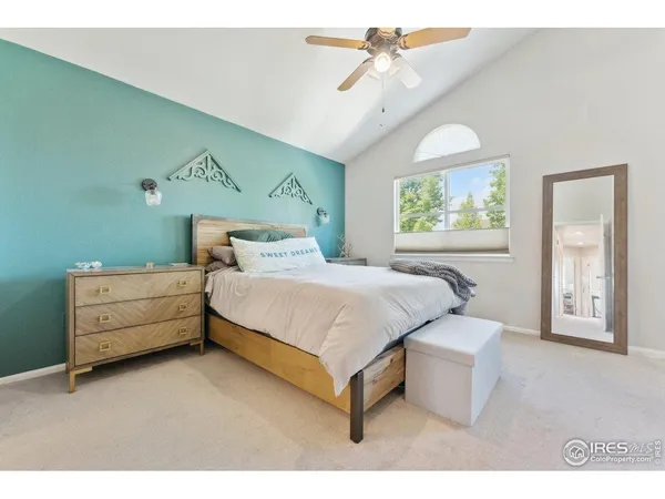 a bed room with a bed and a chandelier