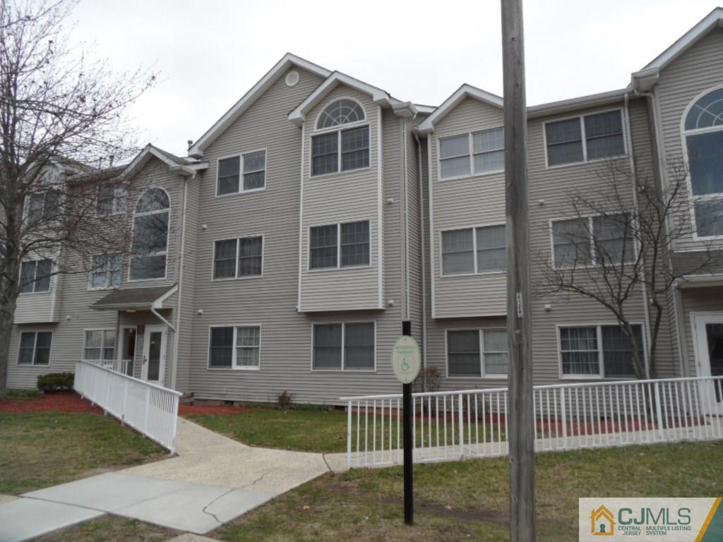 432 Edpas Road, Unit 432 New Brunswick, NJ 08901 - Photo 1 of 22 a front view of a house with a garden