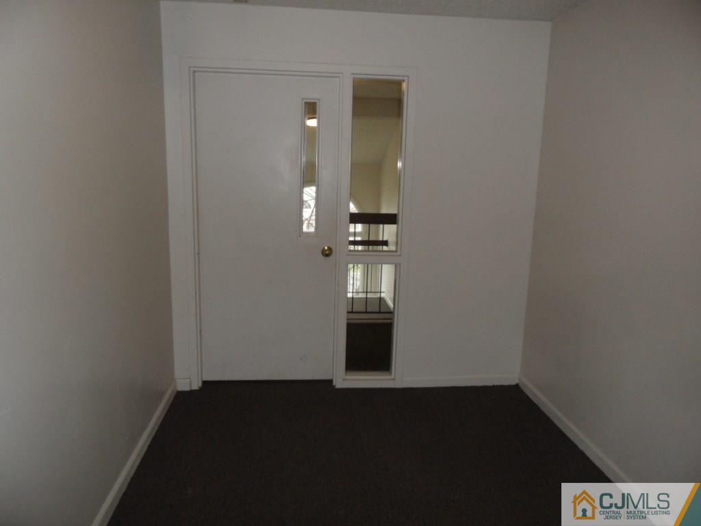 432 Edpas Road, Unit 432 New Brunswick, NJ 08901 - Photo 2 of 22 wooden floor in an empty room