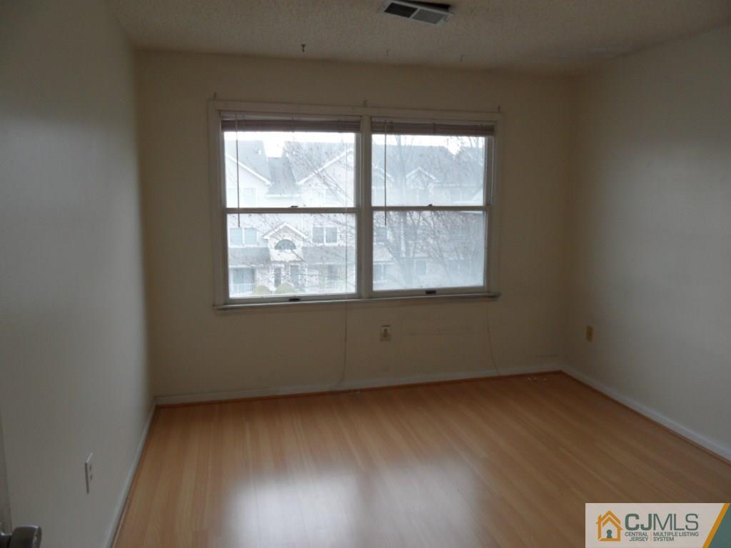 432 Edpas Road, Unit 432 New Brunswick, NJ 08901 - Photo 12 of 22 an empty room with a window