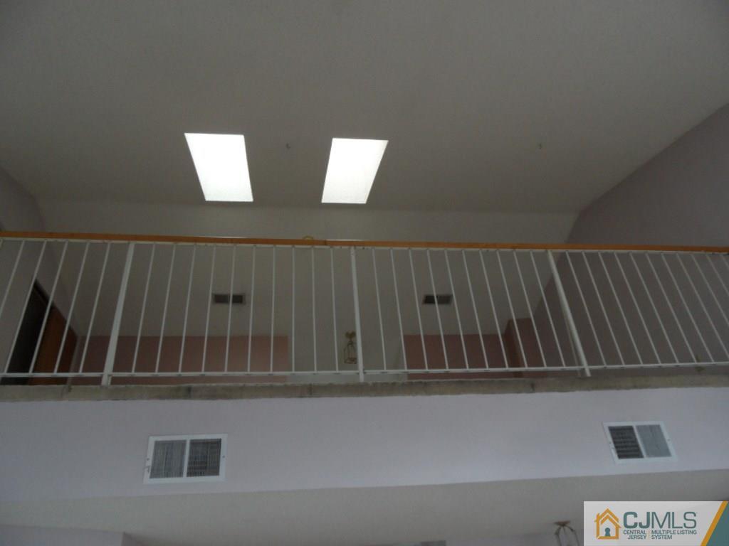 432 Edpas Road, Unit 432 New Brunswick, NJ 08901 - Photo 18 of 22 a view of staircase with white walls