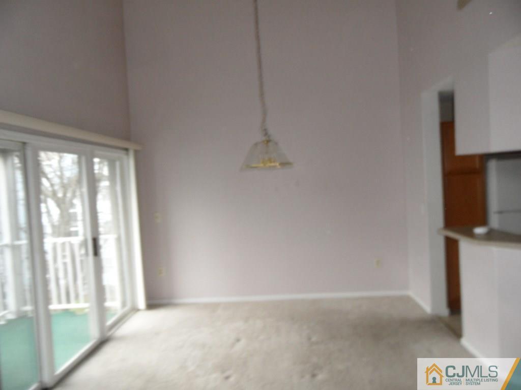 432 Edpas Road, Unit 432 New Brunswick, NJ 08901 - Photo 5 of 22 a view of an empty room with a window