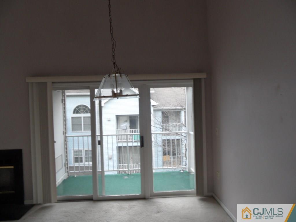 432 Edpas Road, Unit 432 New Brunswick, NJ 08901 - Photo 6 of 22 a living room with a chandelier