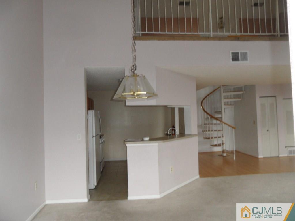 432 Edpas Road, Unit 432 New Brunswick, NJ 08901 - Photo 7 of 22 a view of a livingroom with a washer and dryer