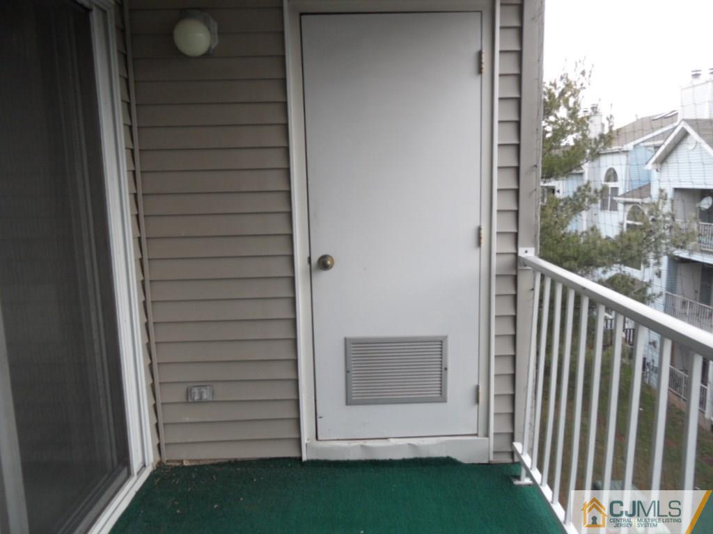 432 Edpas Road, Unit 432 New Brunswick, NJ 08901 - Photo 8 of 22 a view of a door and a window