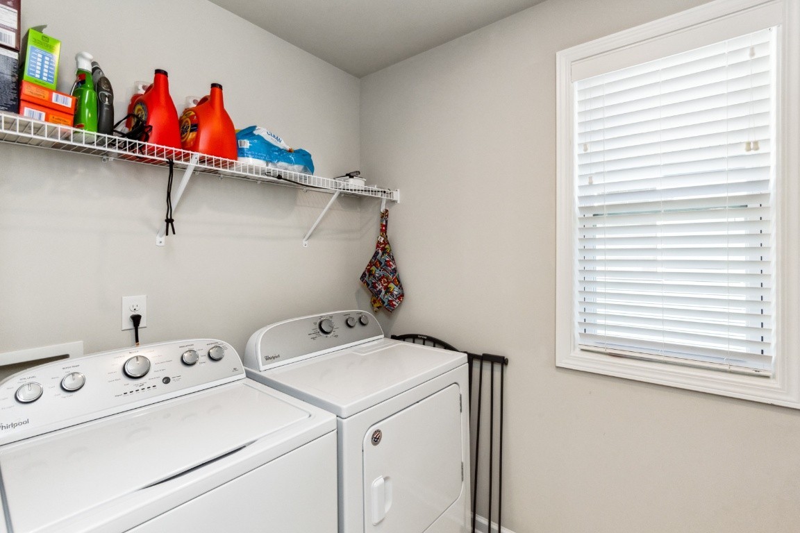 410 Prestige Court Pleasant View, TN 37146 - Photo 12 of 13 a utility room with dryer and washer