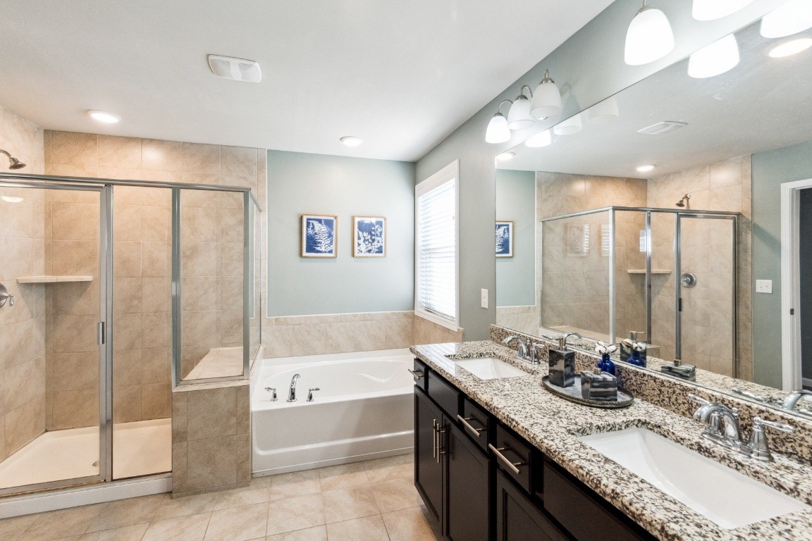 410 Prestige Court Pleasant View, TN 37146 - Photo 7 of 13 a bathroom with a granite countertop sink mirror and a bath tub