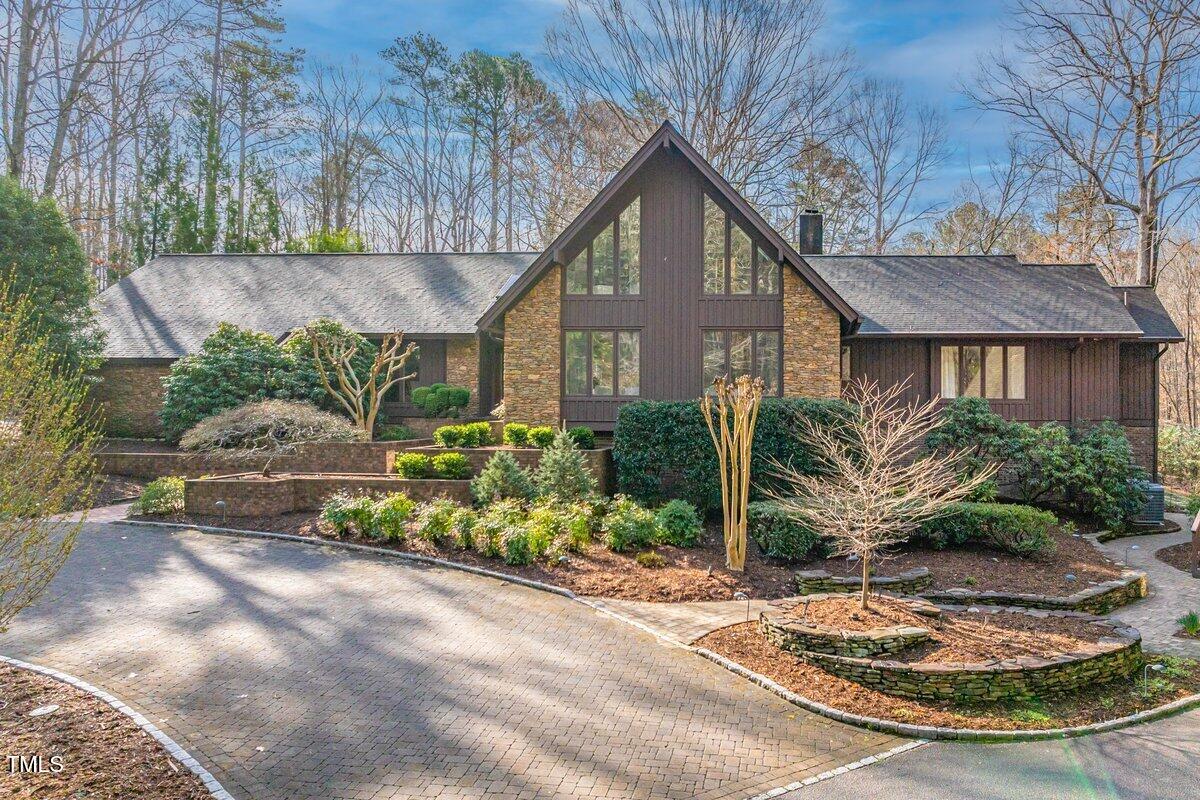 10729 Trego Trail Raleigh, NC 27614 - Photo 1 of 65 a front view of a house with a garden