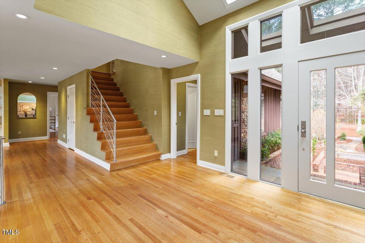 10729 Trego Trail Raleigh, NC 27614 - Photo 11 of 65 a view of a hallway with wooden floor and entryway