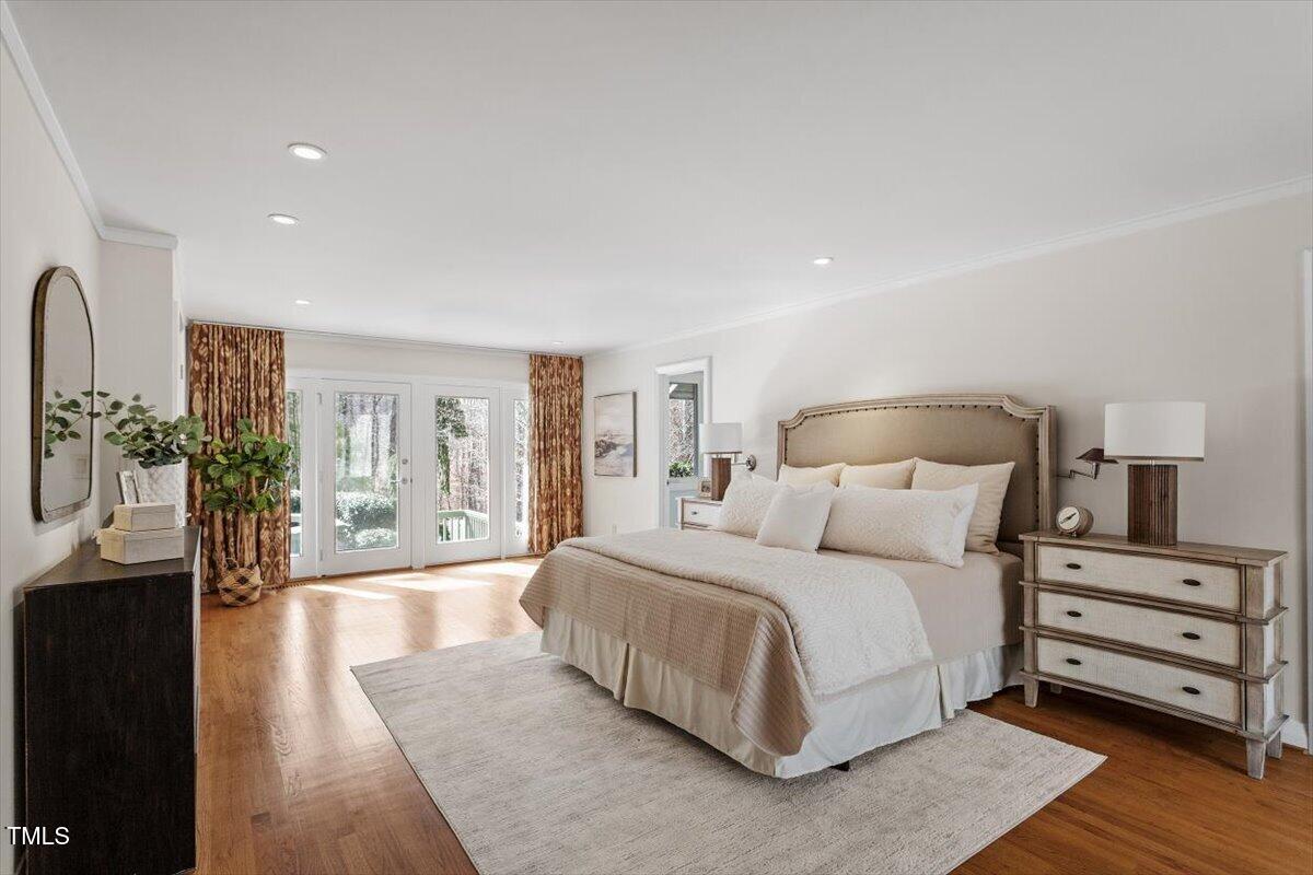 10729 Trego Trail Raleigh, NC 27614 - Photo 24 of 65 a bedroom with a large bed and a night stand