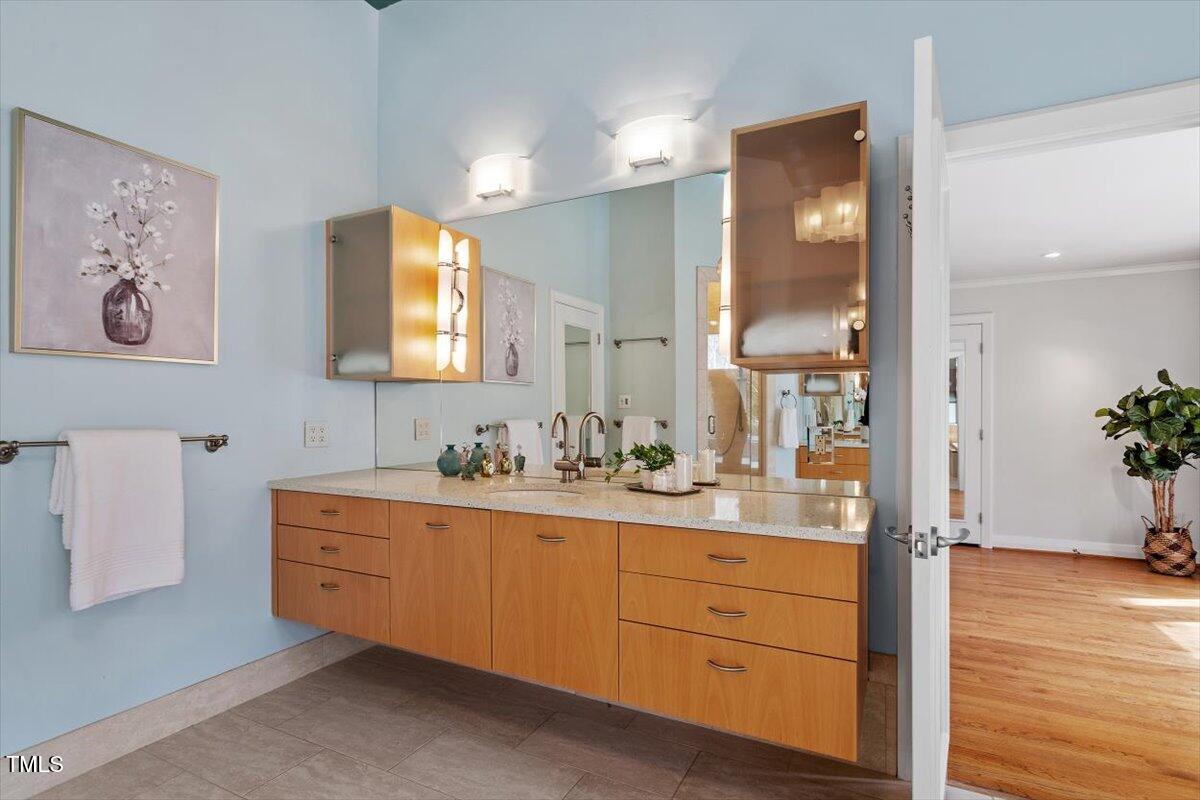 10729 Trego Trail Raleigh, NC 27614 - Photo 27 of 65 a bathroom with a sink mirror and vanity