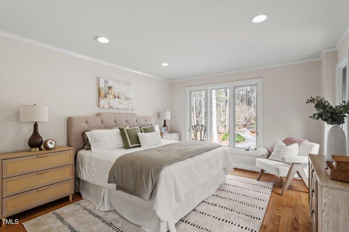 10729 Trego Trail Raleigh, NC 27614 - Photo 29 of 65 a bedroom with a large bed and a window