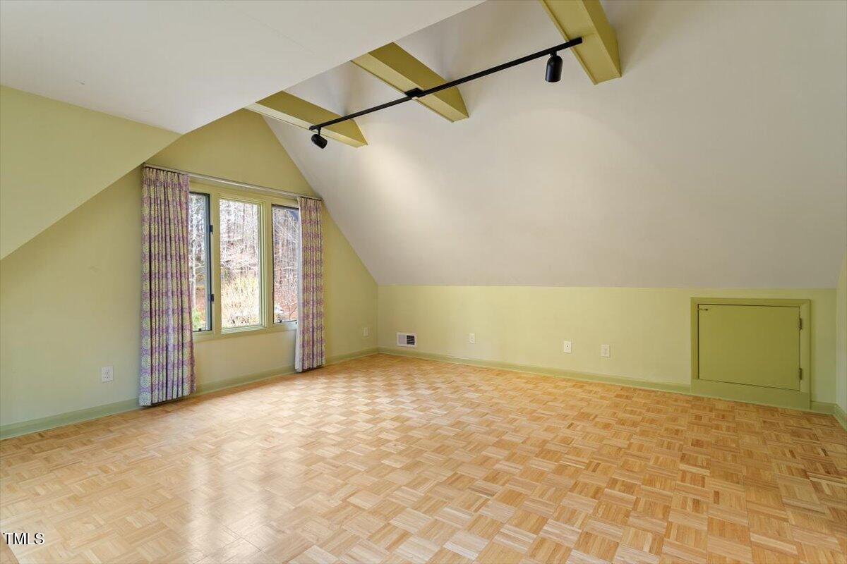 10729 Trego Trail Raleigh, NC 27614 - Photo 44 of 65 a view of an empty room with a window