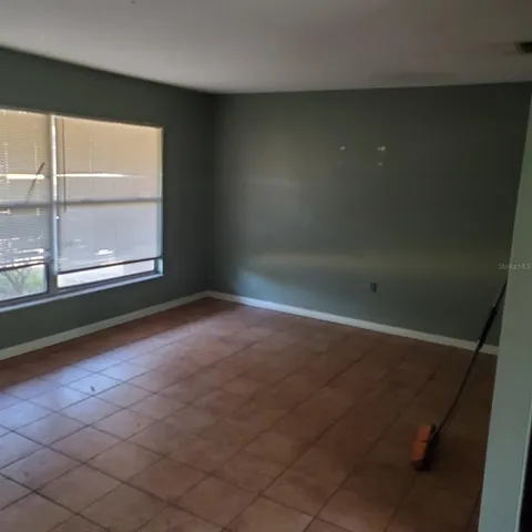 a kitchen with stainless steel appliances granite countertop a refrigerator and a stove