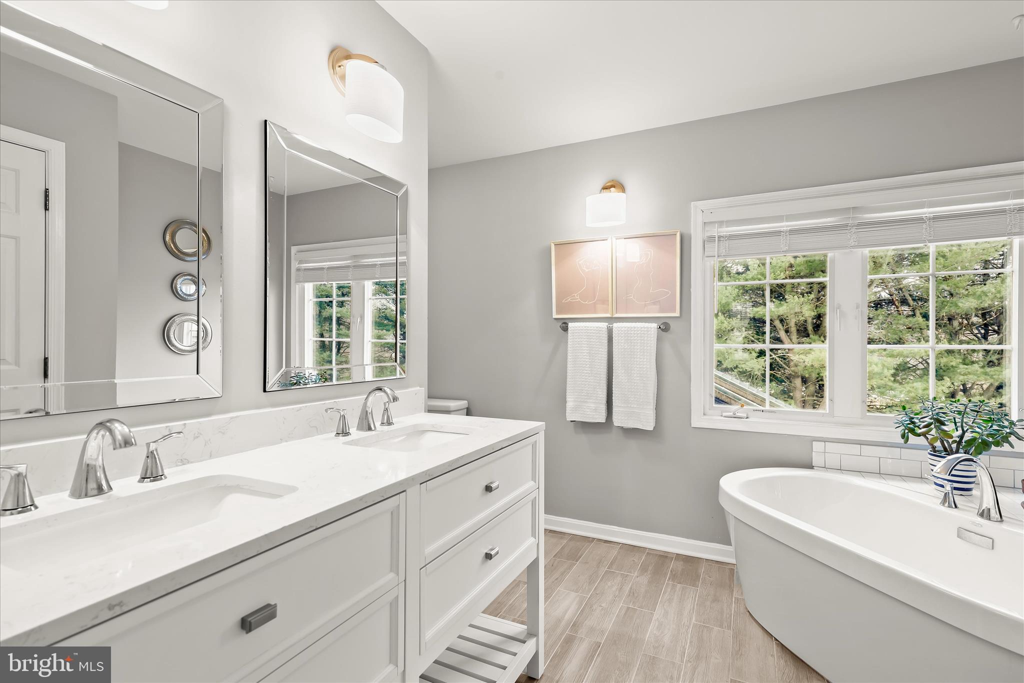 13 Farm Ridge Court Baldwin, MD 21013 - Photo 28 of 61 a bathroom with a double vanity sink large mirror and a bathtub