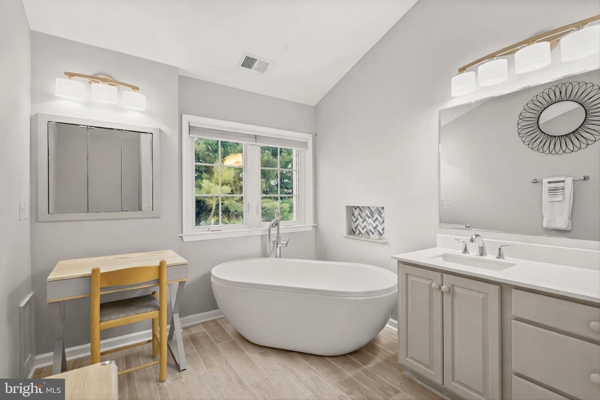 13 Farm Ridge Court Baldwin, MD 21013 - Photo 35 of 61 a spacious bathroom with a double vanity sink mirror and a bathtub