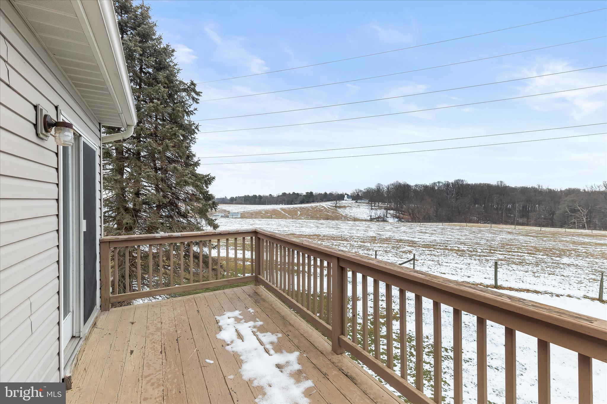 13 Farm Ridge Court Baldwin, MD 21013 - Photo 38 of 61 a view of a balcony with wooden floor and lake view