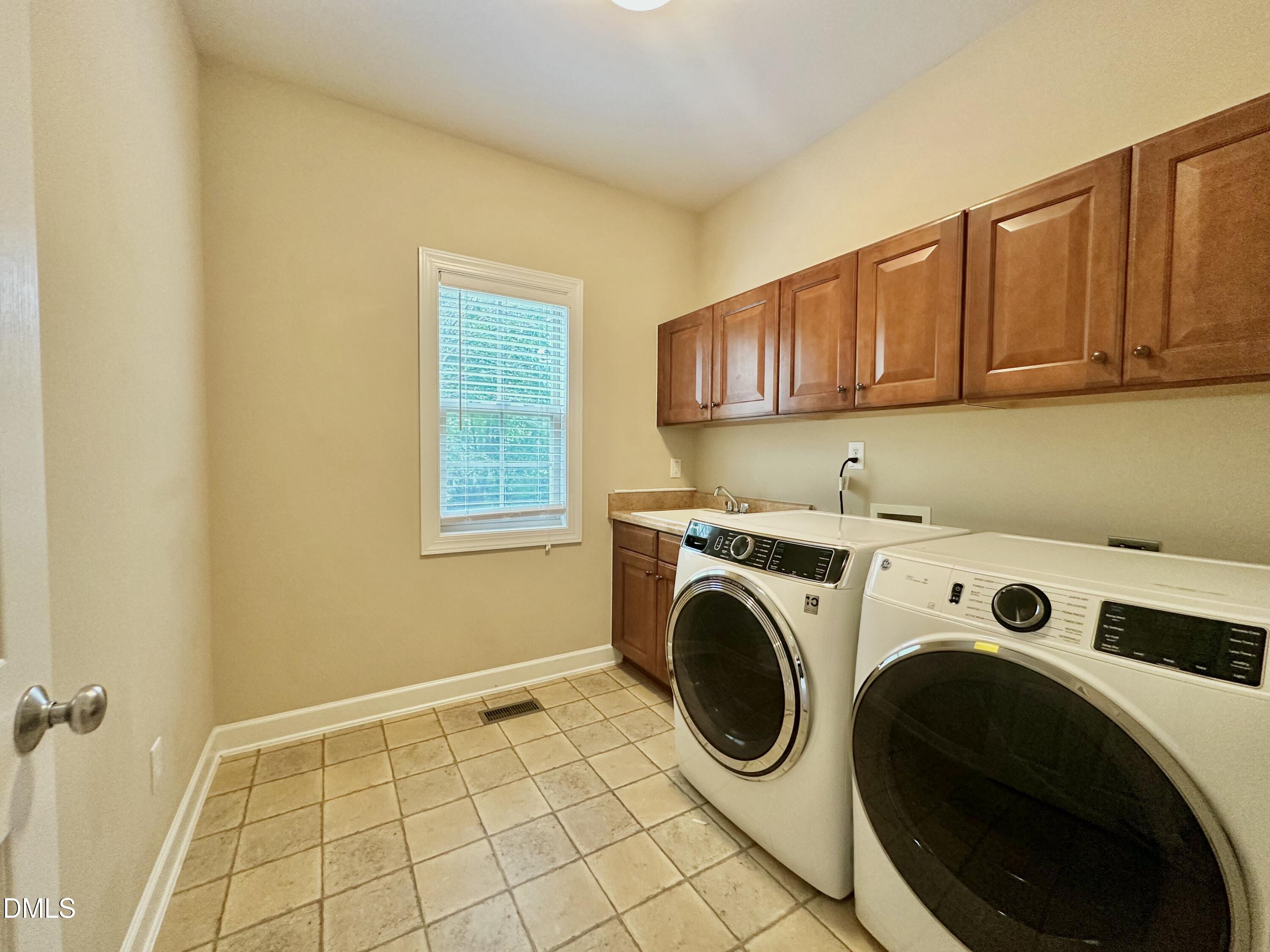 1801 Old London Way Cary, NC 27513 - Photo 19 of 41 a utility room with dryer and washer