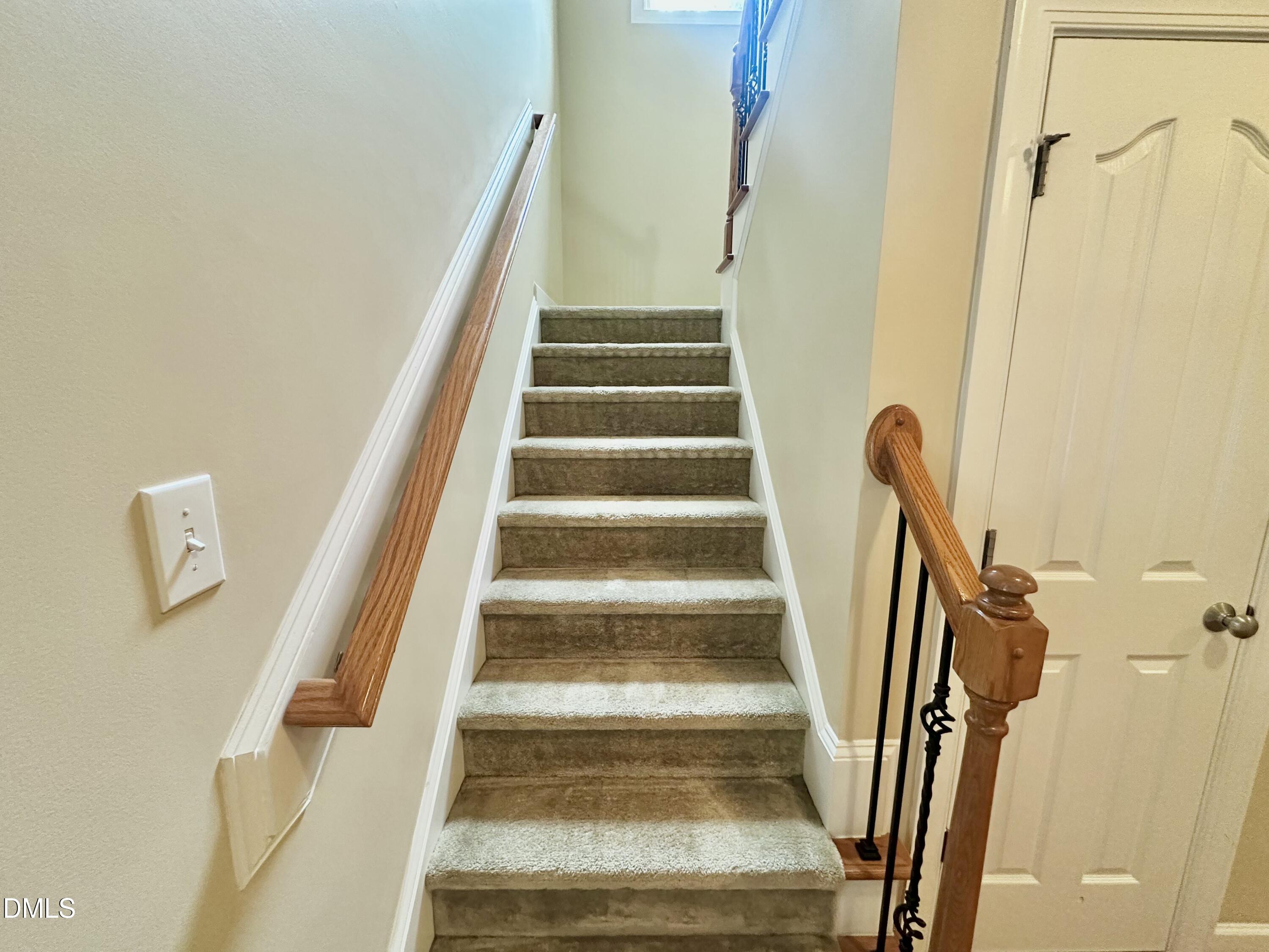 1801 Old London Way Cary, NC 27513 - Photo 21 of 41 a view of staircase with railing and white walls