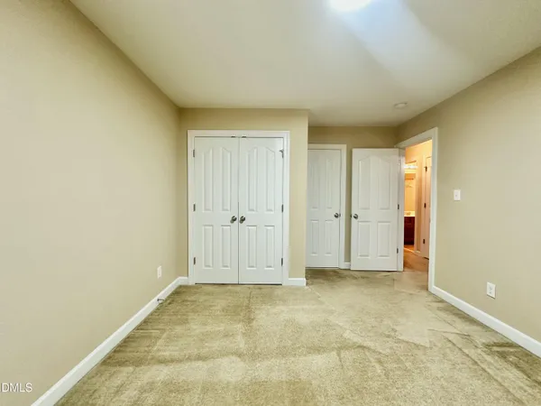 a bathroom with a sink a toilet a shower and a mirror