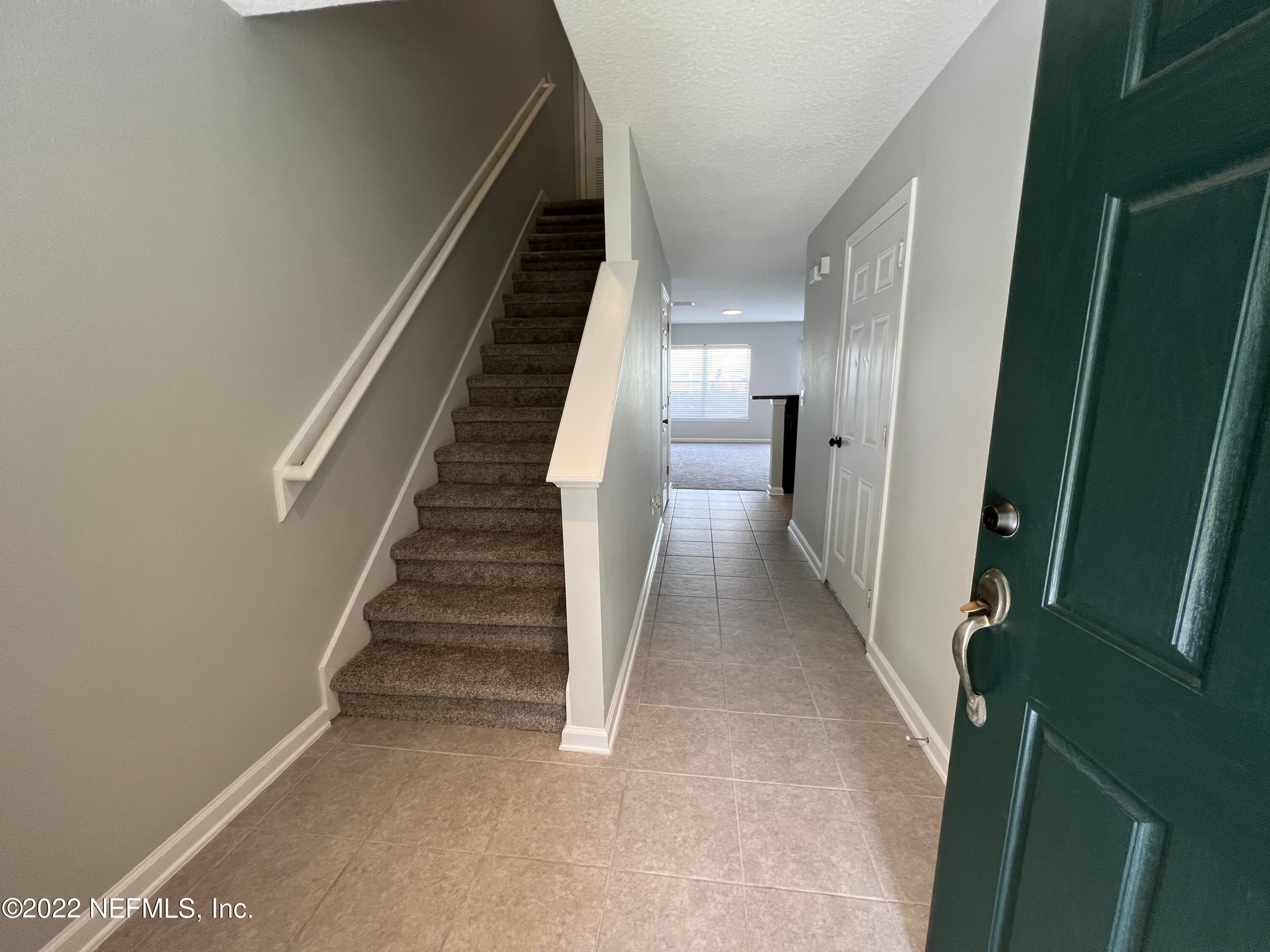 6700 Bowden Road, Unit 802 Jacksonville, FL 32216 - Photo 1 of 19 a view of entryway and gallery with wooden floor