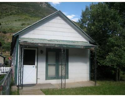 172 Main Street Minturn, CO 81645 - Photo 1 of 3 a view of small white house with outdoor space