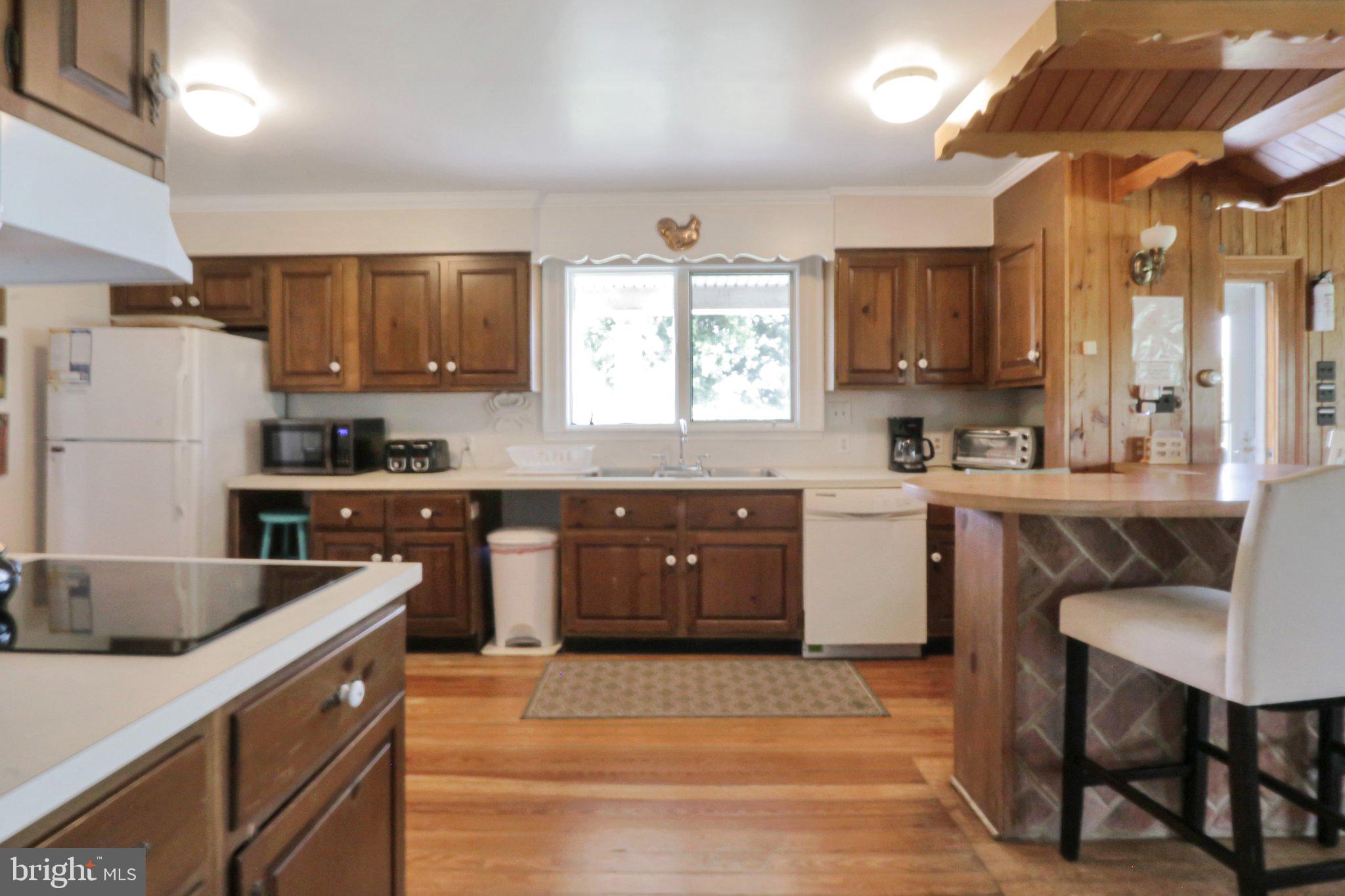 2598 Cherrystone Road Cape Charles, VA 23310 - Photo 21 of 47 Charming kitchen with warm wood accents.
