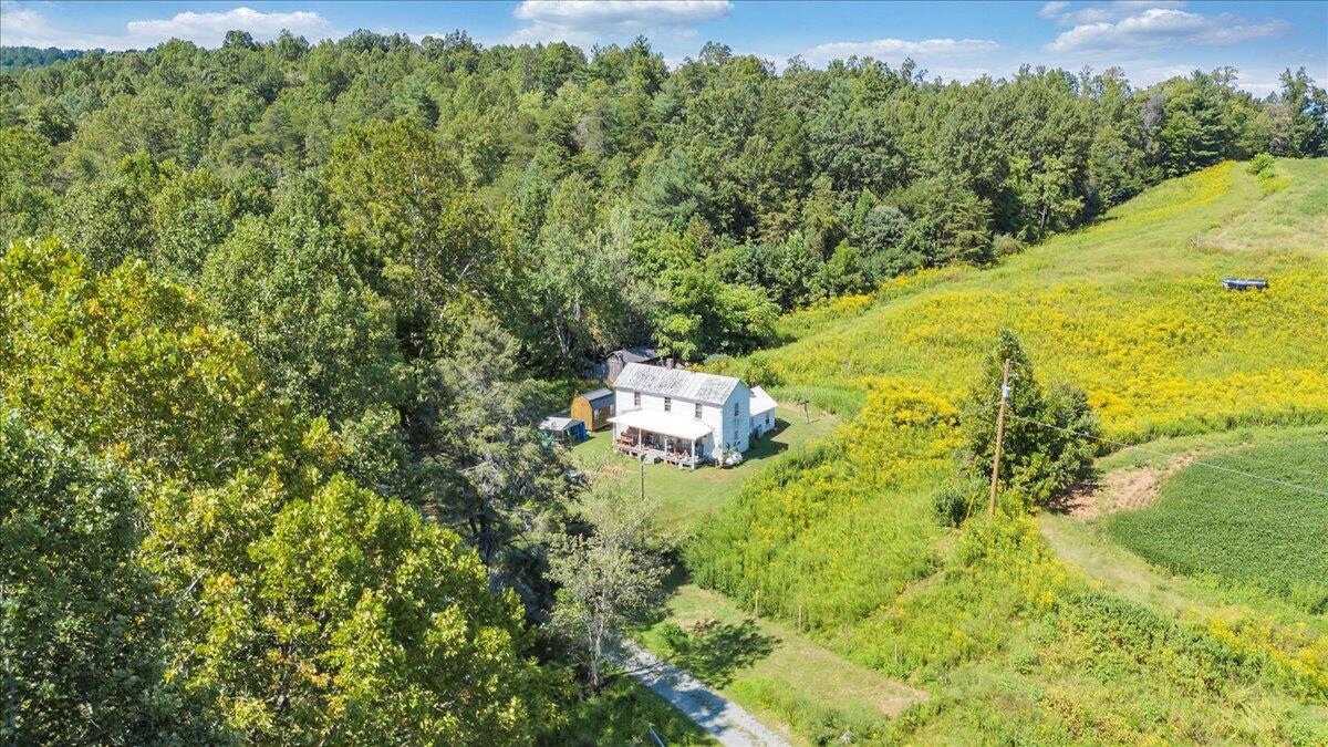5741 Providence Church Road Ferrum, VA 24088 - Photo 40 of 52 a backyard of a house with a yard and lake view
