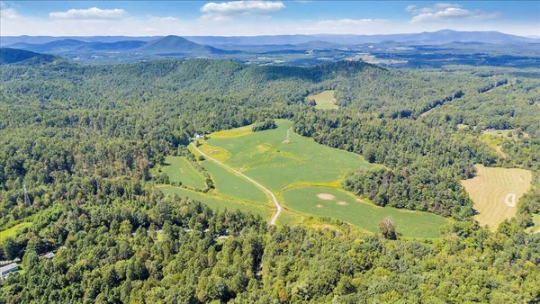 a view of a field with an ocean
