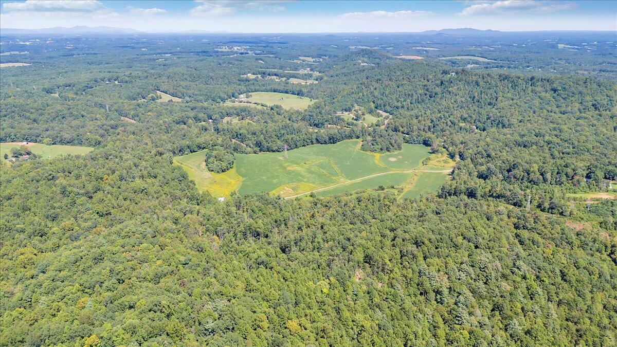 5741 Providence Church Road Ferrum, VA 24088 - Photo 10 of 52 a view of a lake with a mountain in the background