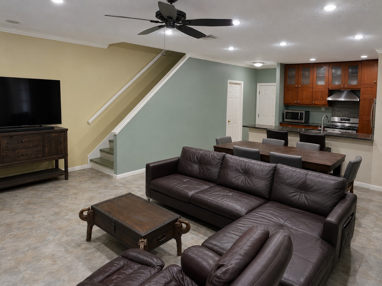 6000 Reims Road, Unit 3601 Houston, TX 77036 - Photo 2 of 13 a living room with furniture and a flat screen tv