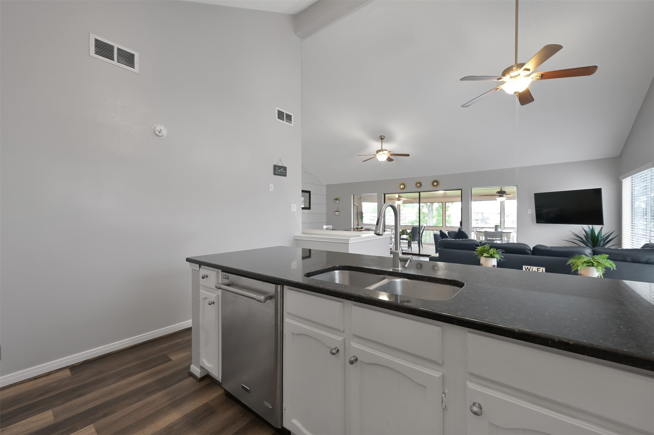 124 April Point Drive North Montgomery, TX 77356 - Photo 12 of 26 a kitchen with a sink and chandelier