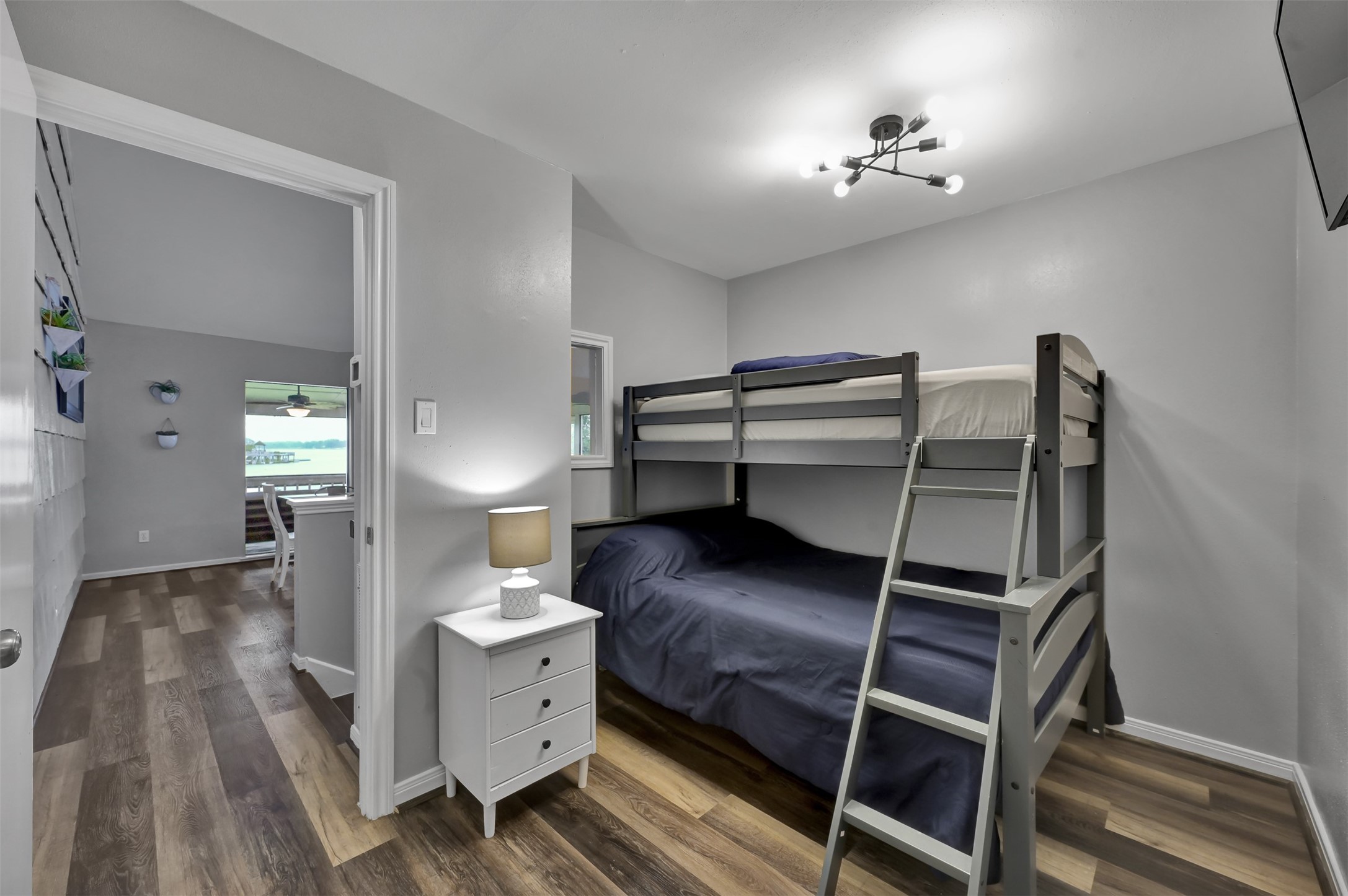 124 April Point Drive North Montgomery, TX 77356 - Photo 13 of 26 a bedroom with a bed and a chandelier