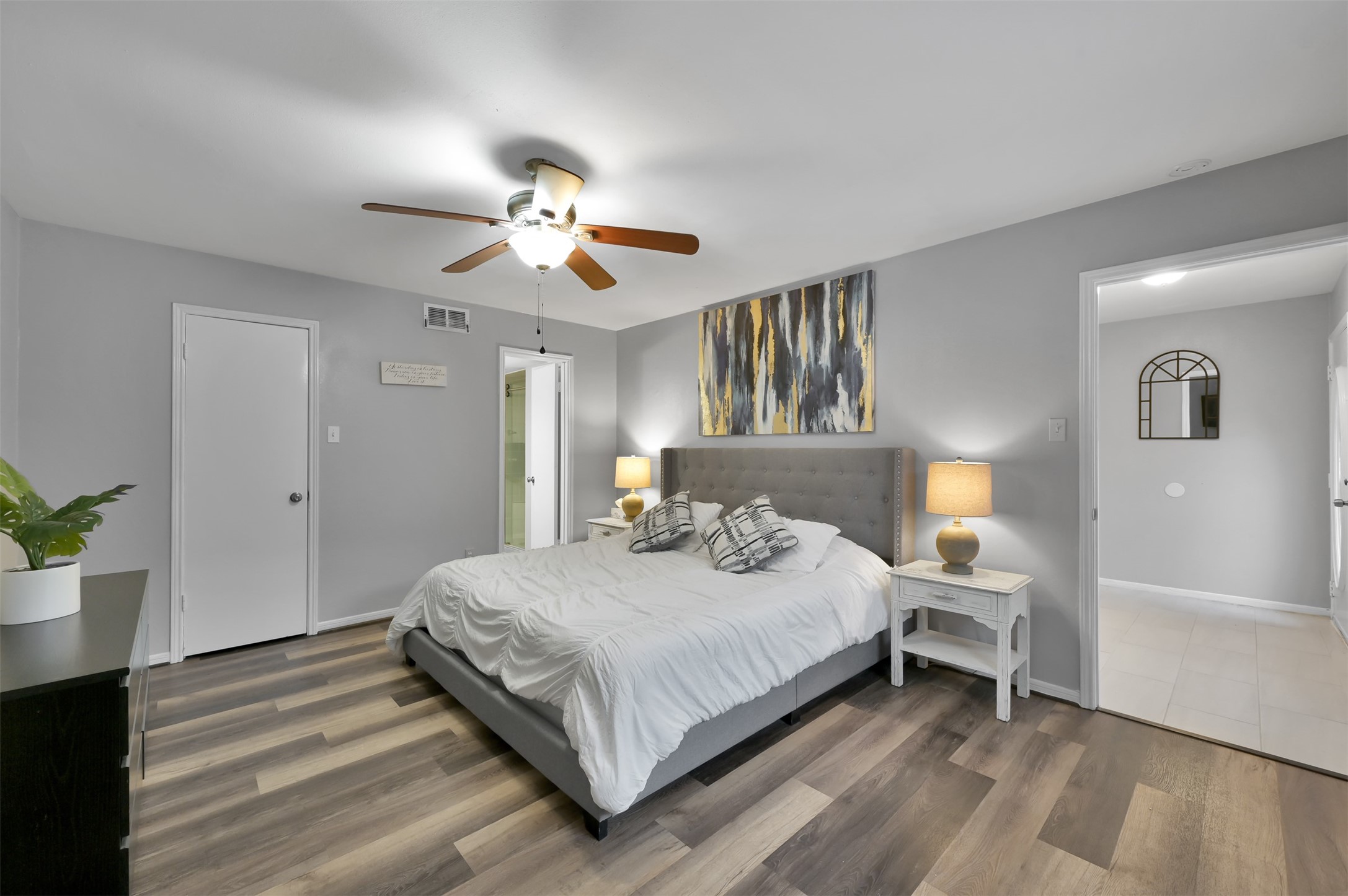 124 April Point Drive North Montgomery, TX 77356 - Photo 16 of 26 a bedroom with a bed and a chandelier