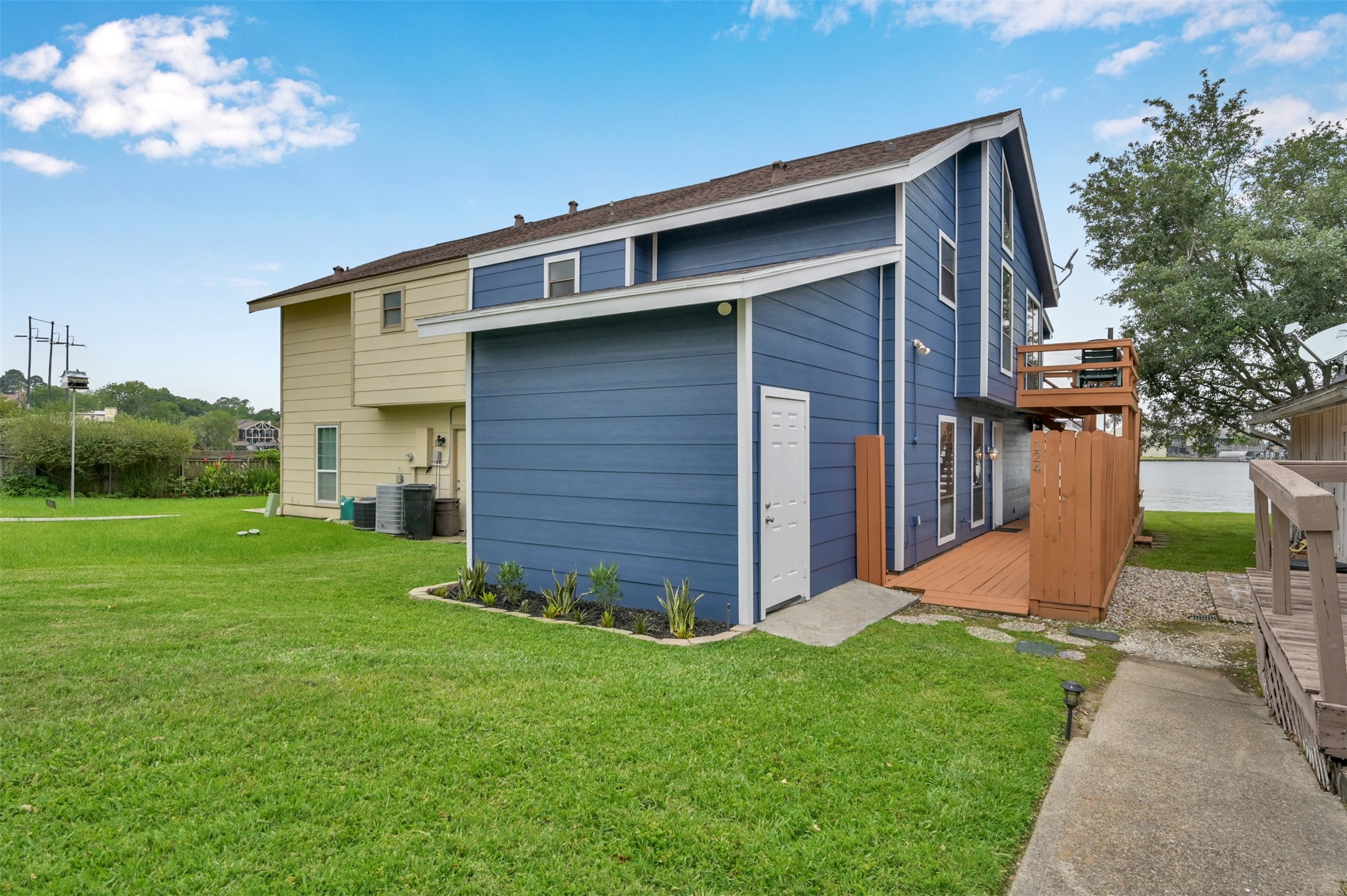 124 April Point Drive North Montgomery, TX 77356 - Photo 3 of 26 a front view of a house with garden