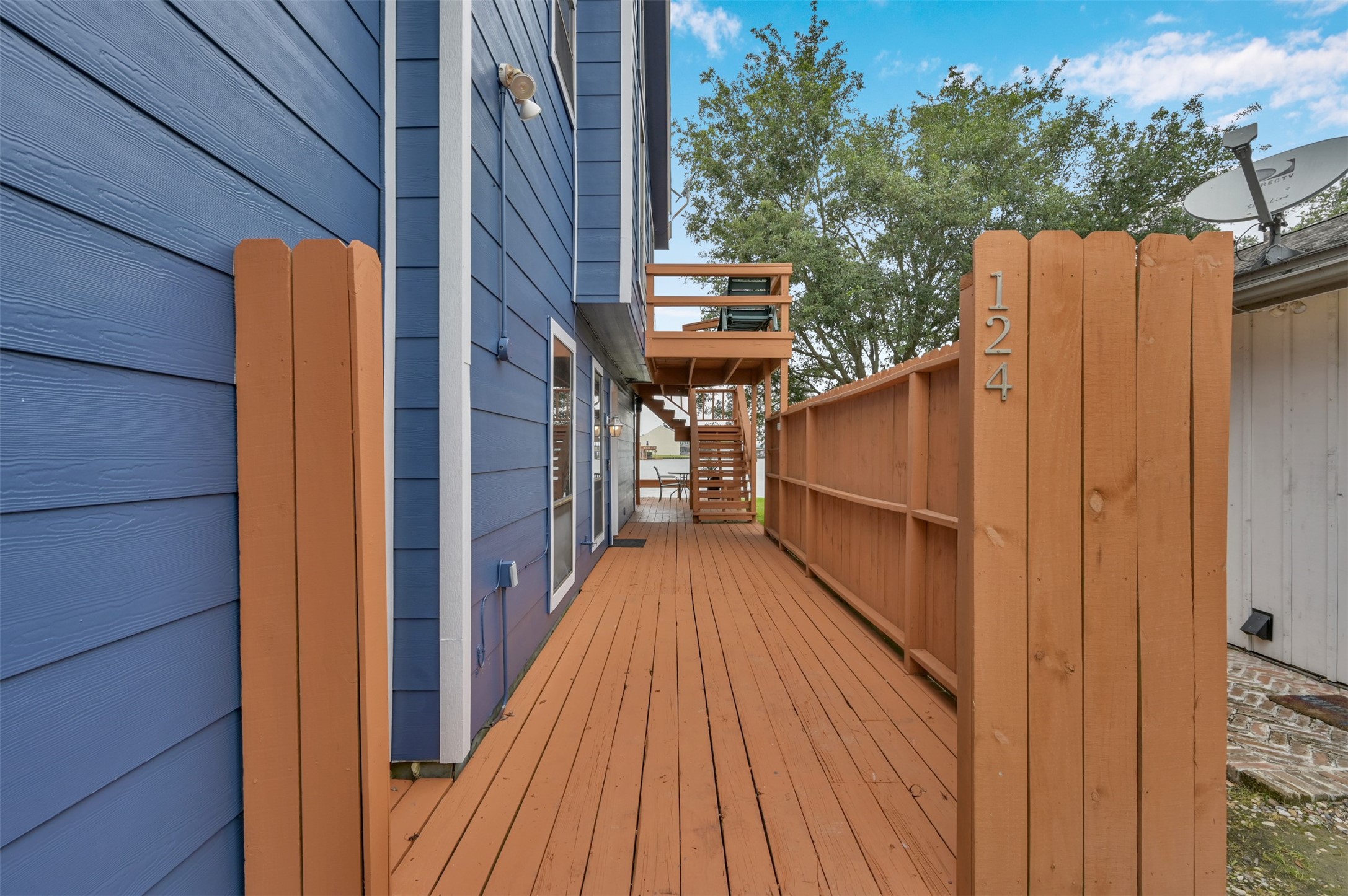 124 April Point Drive North Montgomery, TX 77356 - Photo 4 of 26 a view of balcony with wooden floor and fence