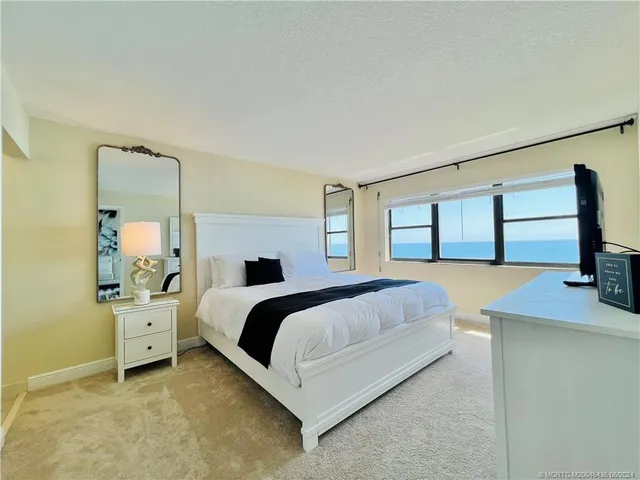 a bathroom with a toilet and a shower curtain