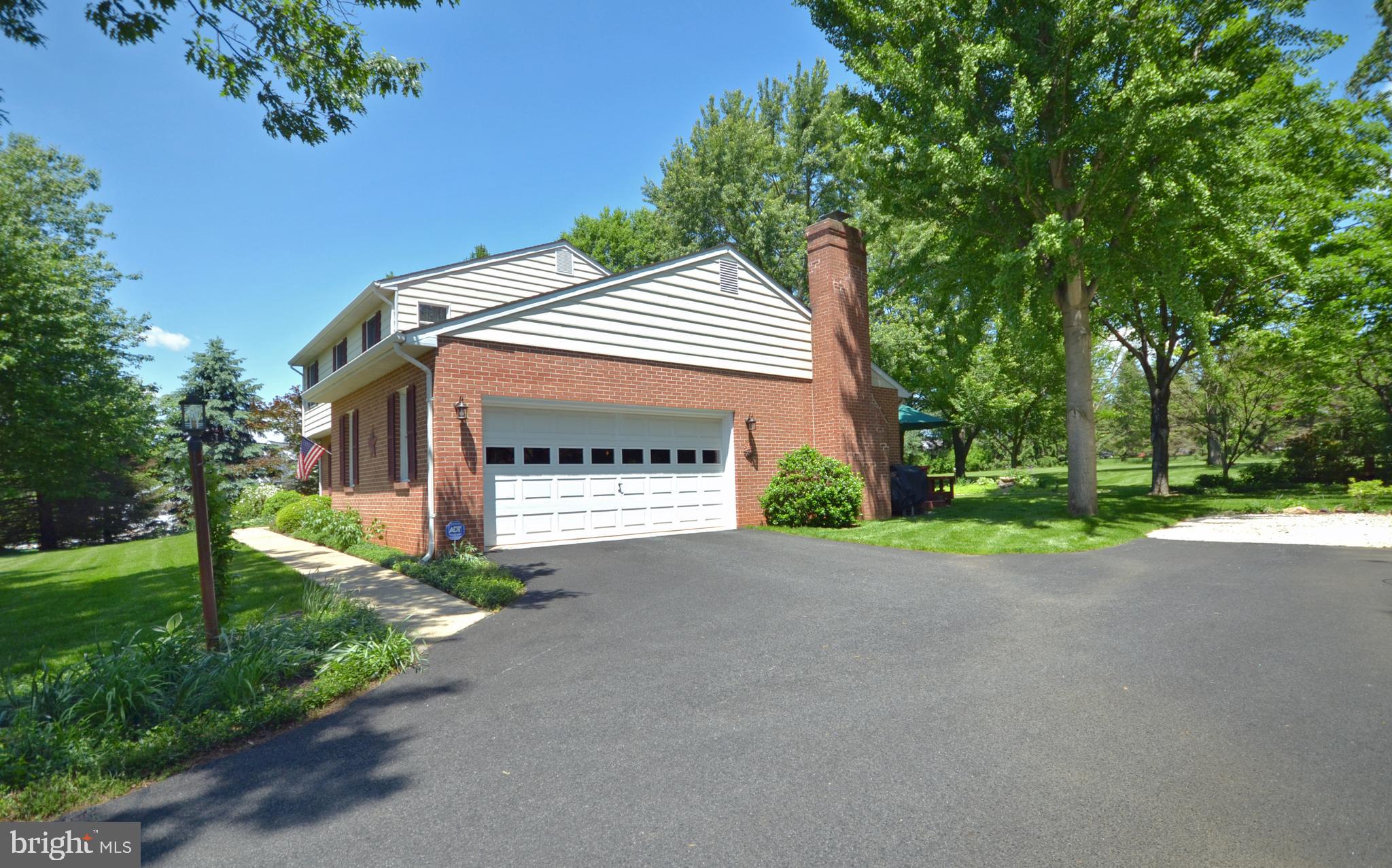 2 car side entry garage & paved driveway