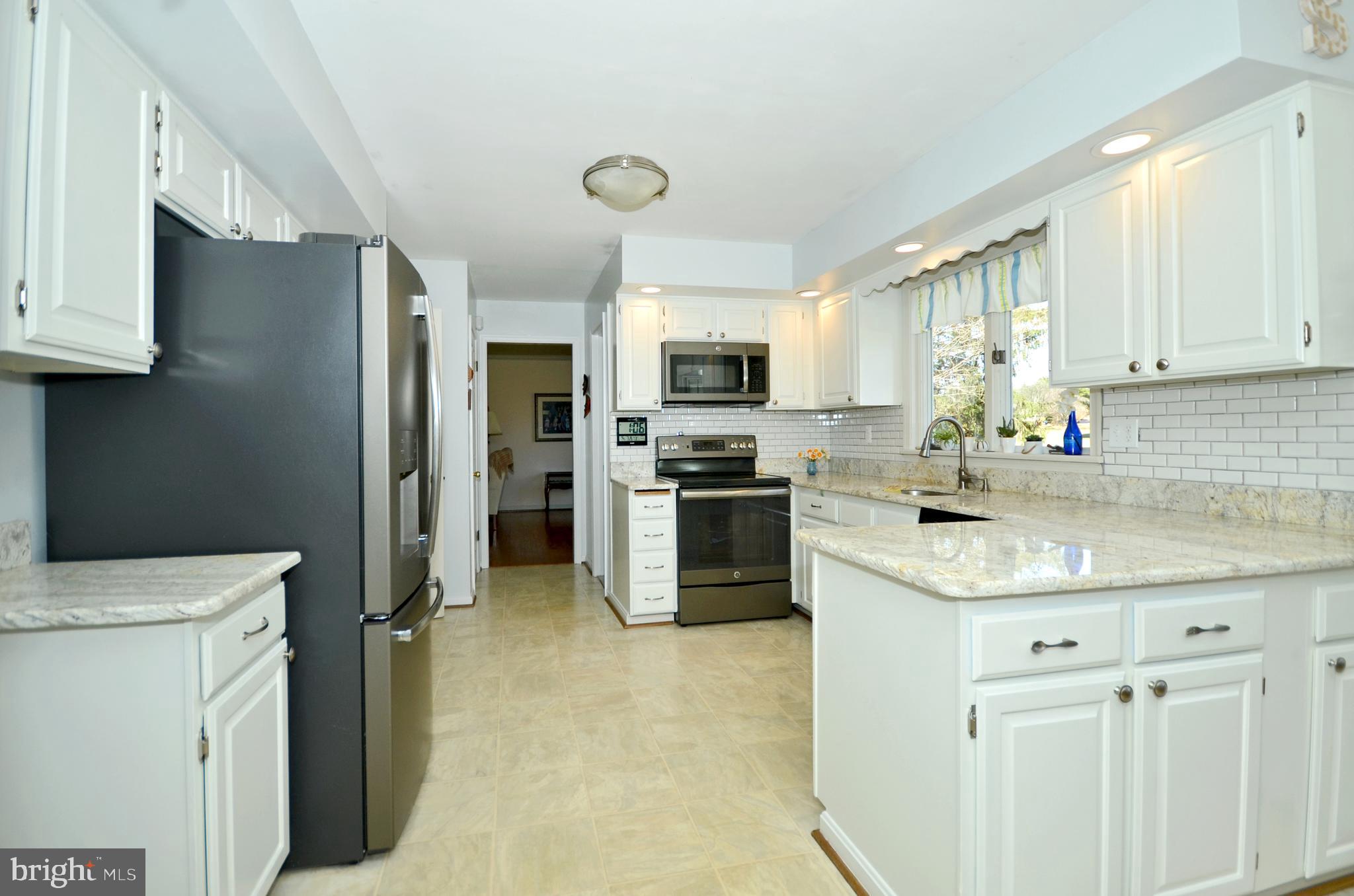 Stainless steel appliances w/ slate finish.