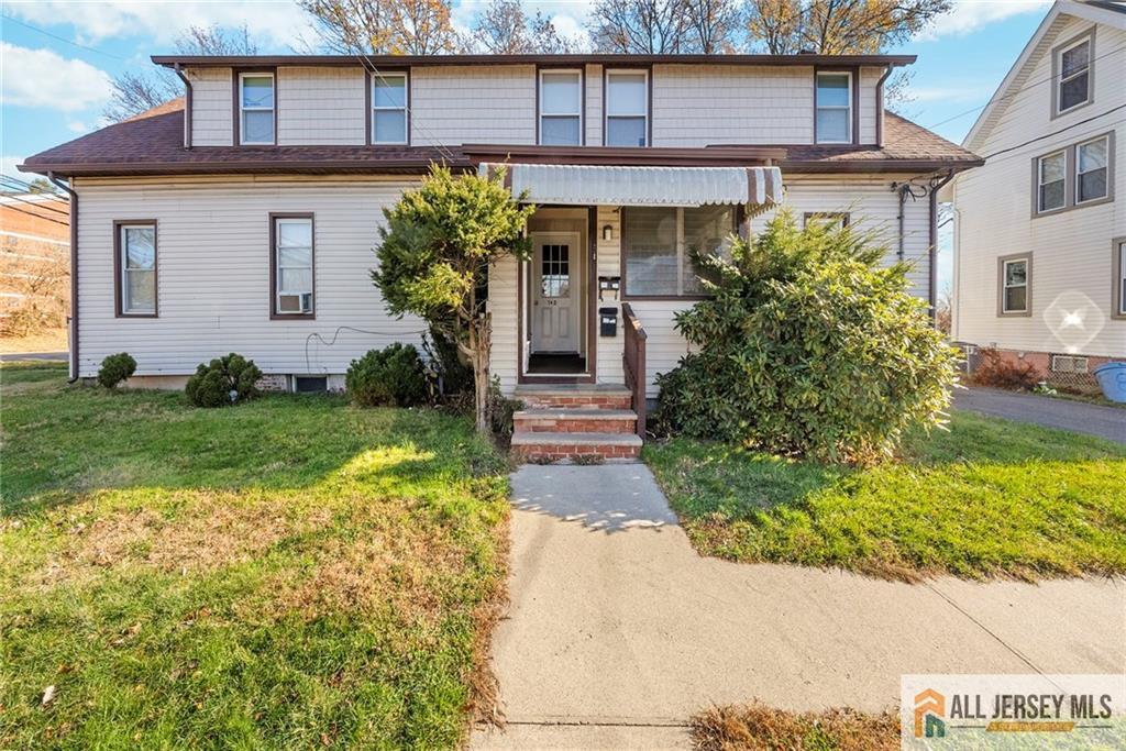 2102 Woodbridge Avenue, Unit 2 Edison, NJ 08817 - Photo 1 of 19 a front view of a house with garden