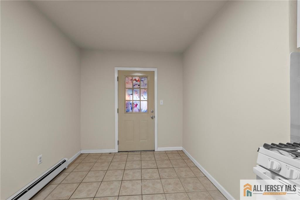 2102 Woodbridge Avenue, Unit 2 Edison, NJ 08817 - Photo 13 of 19 a view of an empty room and window