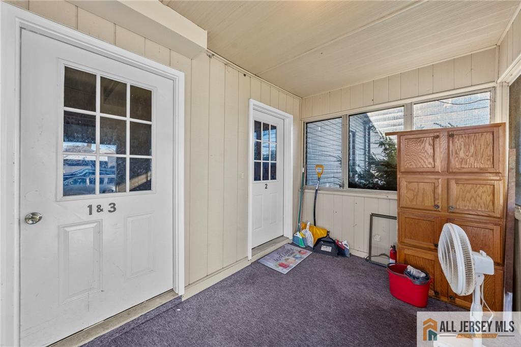 2102 Woodbridge Avenue, Unit 2 Edison, NJ 08817 - Photo 15 of 19 a view of living room with furniture and windows
